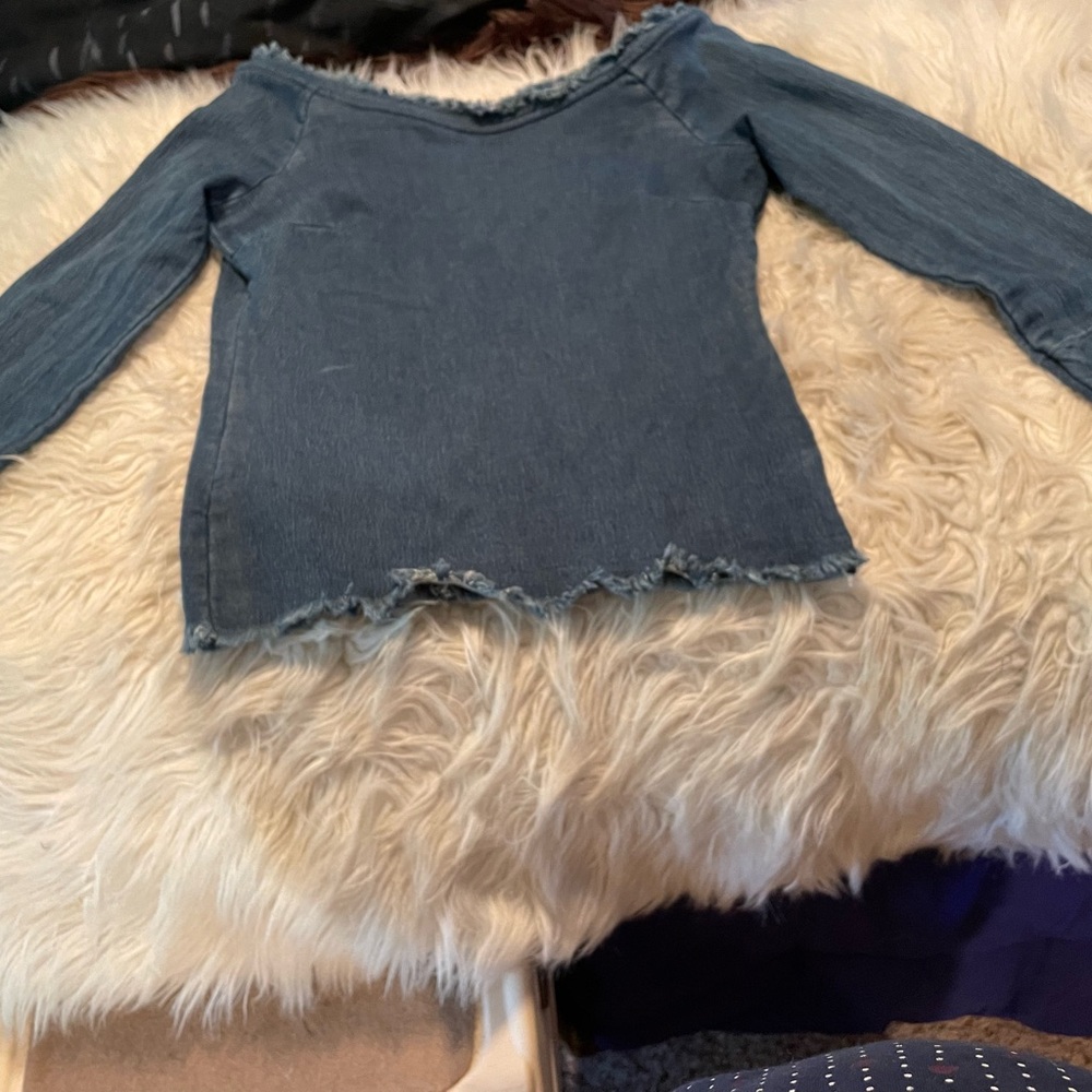 Off shoulder denim top.